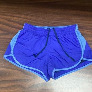 Purple Nike running shorts, black spandex underneath that makes it very comfy.